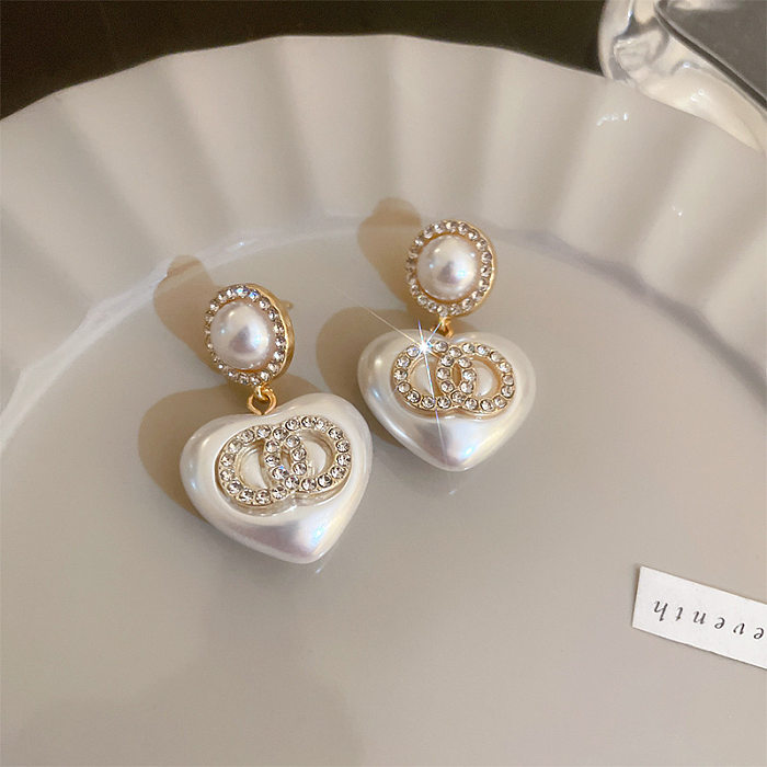 1 Paar elegante Tropfen-Ohrringe mit Buchstaben-Schleife und Knoten-Inlay aus Metall, Kupfer, Perle und Zirkon