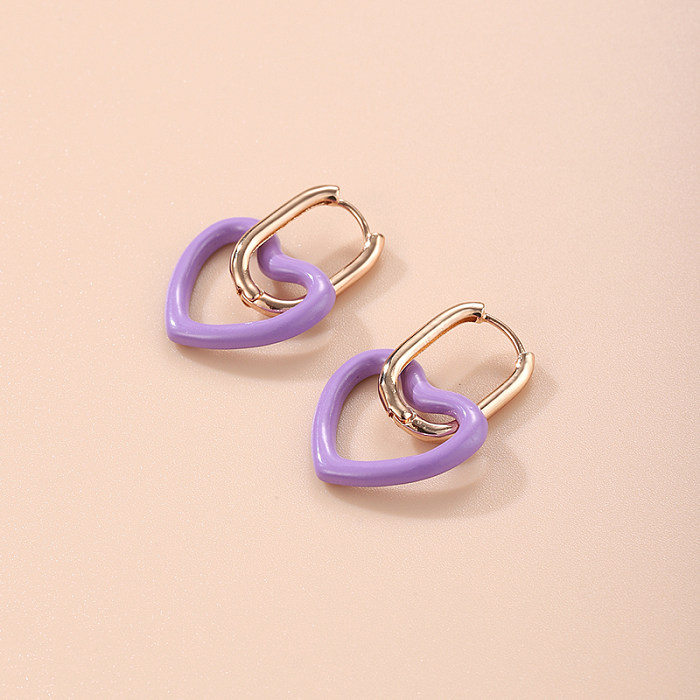 1 paire de jolies boucles d'oreilles pendantes en forme de cœur plaqué cuivre