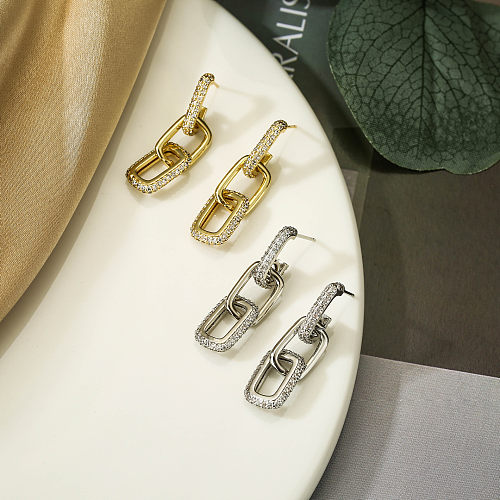 1 paire de boucles d'oreilles pendantes Hip-Hop avec incrustation géométrique en cuivre et Zircon