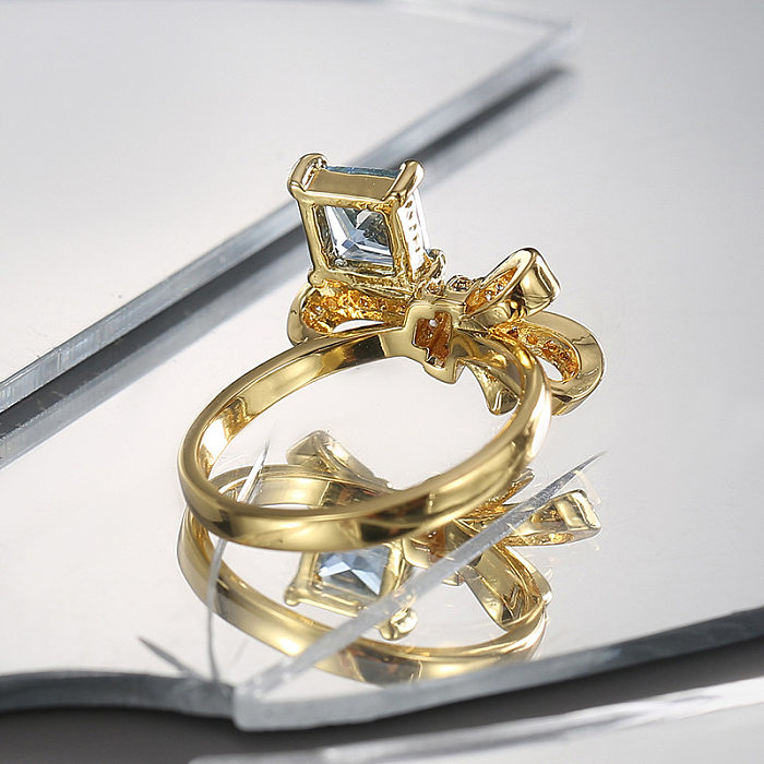 Anéis banhados a ouro de zircônia com chapeamento de cobre com nó de arco de estilo simples