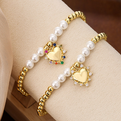 Pulseras chapadas en oro de 18K con circonitas artificiales con incrustaciones de cobre en forma de corazón de viaje de estilo simple