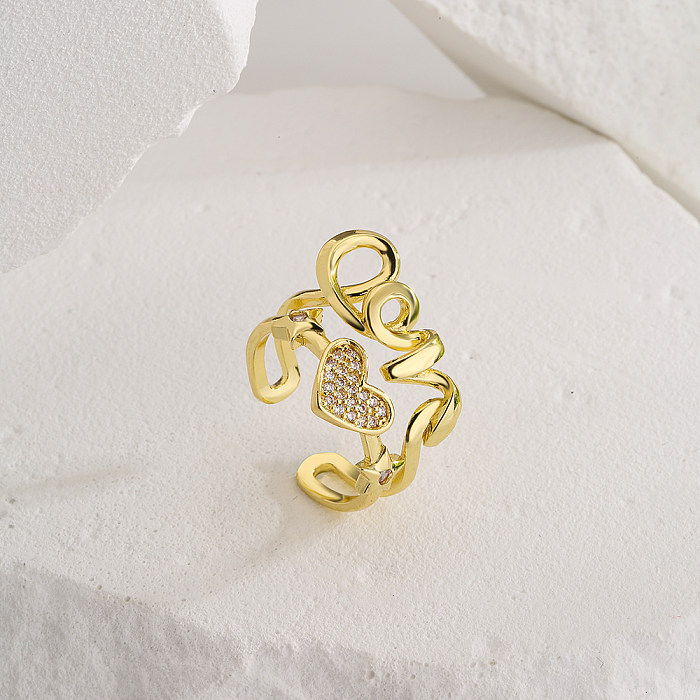 Anel aberto de cobre em formato de coração de amor fashion com zircônias banhado a ouro