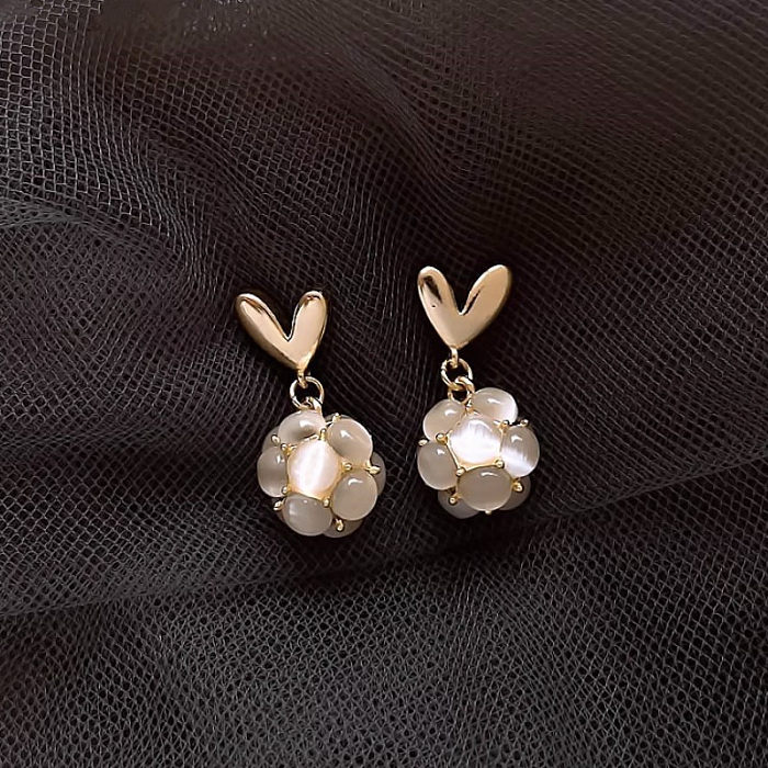 1 paire de boucles d'oreilles pendantes en cuivre plaqué en forme de cœur pour dame