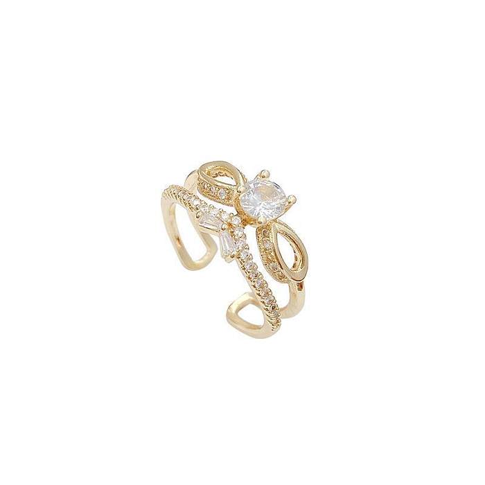Anéis abertos de zircão com embutimento de cobre com nó de arco doce