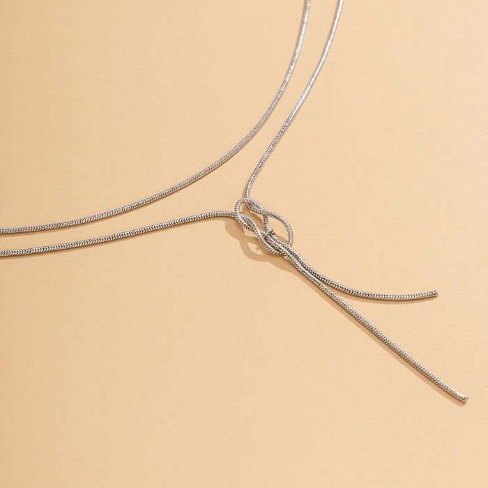 Colliers superposés en placage de cuivre avec nœud de style simple et sexy