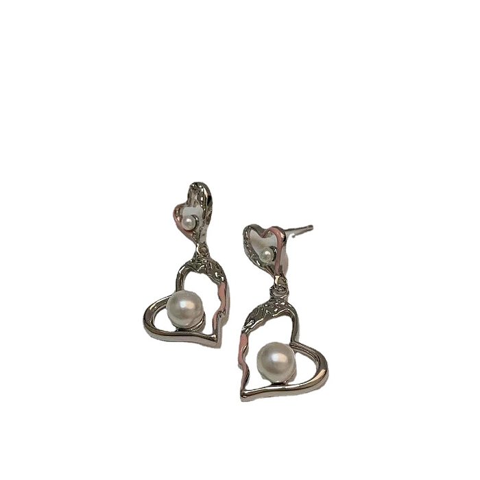 1 paire de boucles d'oreilles plaquées cuivre en forme de cœur, style simple