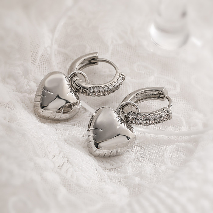 1 paire de boucles d'oreilles pendantes en forme d'étoile et de cœur, Style Simple, incrustation de cuivre et de Zircon plaqué or 18 carats