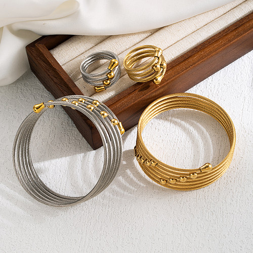 Elegante, runde, 18 Karat vergoldete Ringarmbänder aus Edelstahl im INS-Stil
