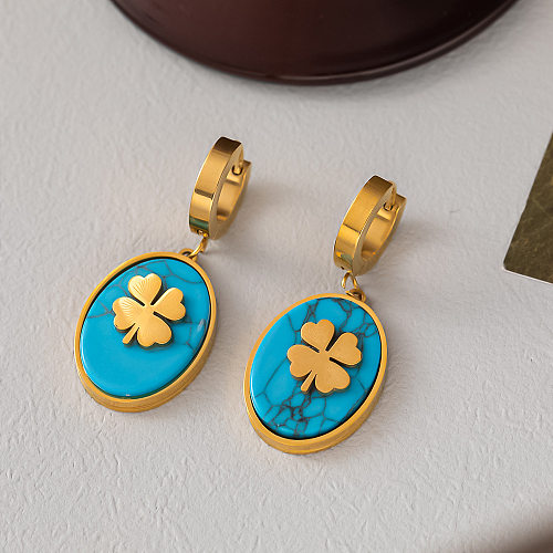 Collier élégant de boucles d'oreilles turquoise avec incrustation d'acier et de titane trèfle à quatre feuilles