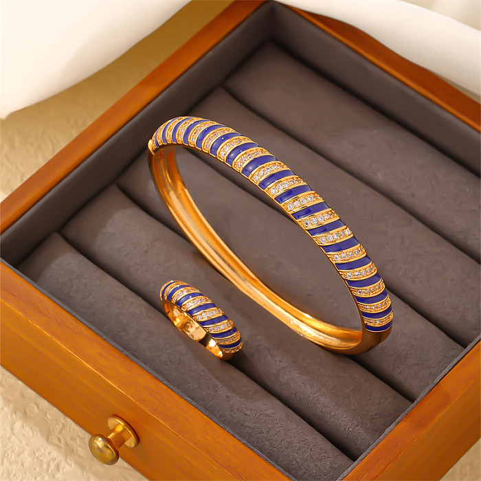 Pulseras de anillos chapados en oro con incrustaciones de esmalte de cobre y rayas en espiral redondas geométricas para mujer elegantes