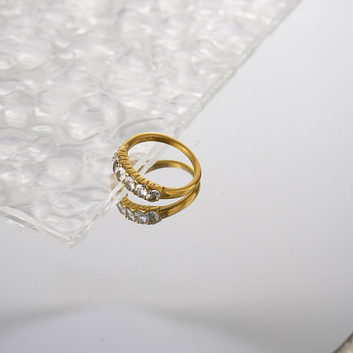 Atacado estilo simples redondo chapeamento de aço inoxidável incrustado anéis de zircão banhados a ouro