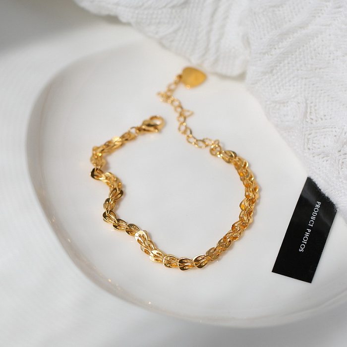 Collier de bracelets en or incrusté d'acier de titane de couleur unie en forme de coeur de mode