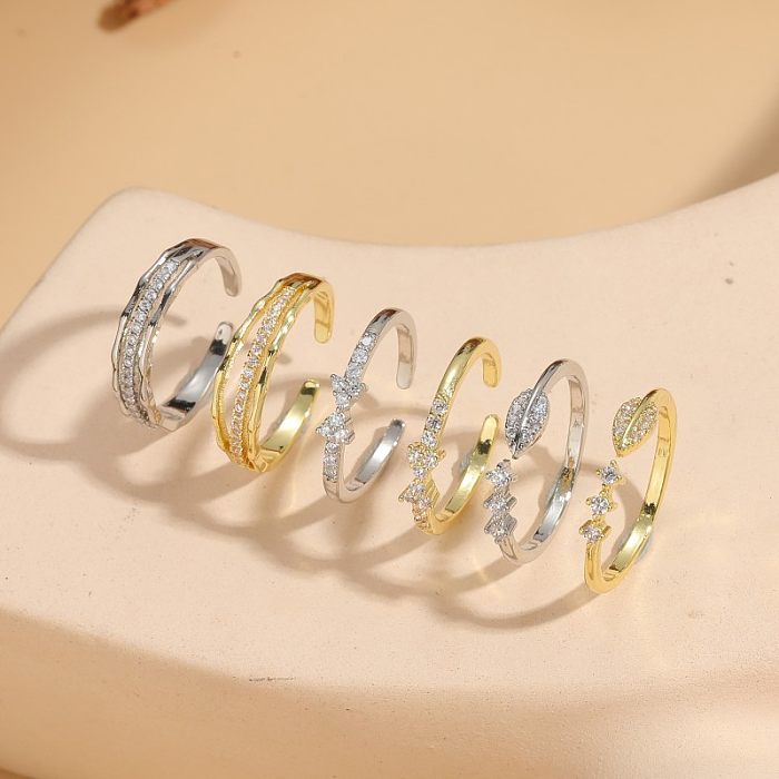 Feuilles brillantes noeud papillon incrustation de placage de cuivre Zircon anneaux ouverts plaqués or 14 carats