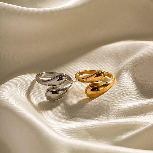Unregelmäßiger, überkreuzter, offener Ring aus Edelstahl im INS-Stil