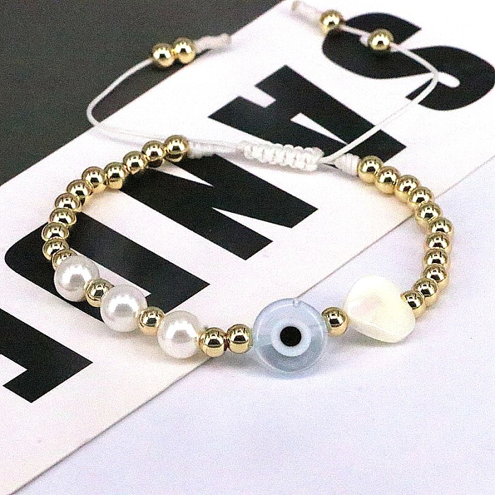 Hip-Hop Rond Forme Coeur Oeil Imitation Perle Corde Cuivre Perlé Plaqué Or Coquille Bracelets 1 Pièce