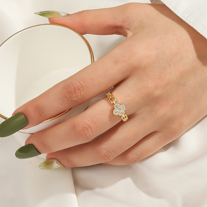 Niedlicher, modischer, offener Ring aus Kupfer mit vierblättrigem Kleeblatt und transparentem Zirkon mit Mikroeinlage
