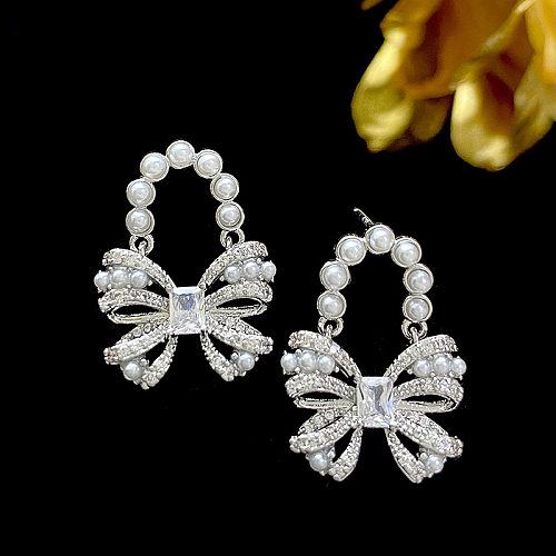 1 paire de boucles d'oreilles en cuivre avec incrustation de nœud papillon Lolita, perles artificielles en Zircon