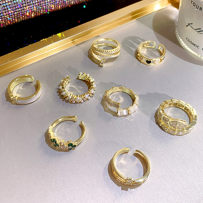 Elegante aleación geométrica con incrustaciones de cobre, perlas artificiales, diamantes de imitación, anillo abierto chapado en oro de 14 quilates