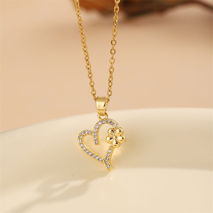 Glänzende Halskette in Herzform aus Edelstahl mit Inlay aus Zirkon und 18-karätigem Gold