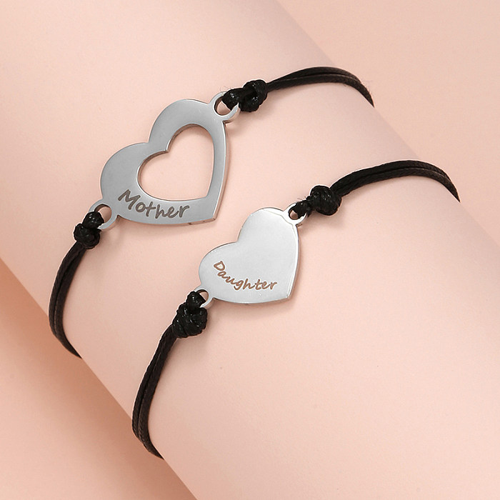 Bracelets à cordon en acier titane avec lettre de style simple, vente en gros