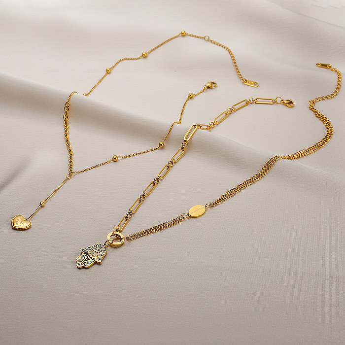 Venta al por mayor, collar con colgante chapado en oro de 1 quilates de acero inoxidable con forma de corazón de la mano artística de Fátima de 18 pieza
