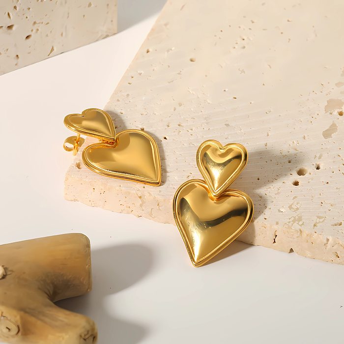 1 par de brincos elegantes em formato de coração doce em aço inoxidável