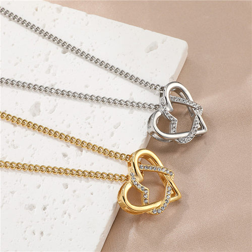 Süße schlichte Herzform-Edelstahl-Halskette mit ausgehöhltem Inlay-Zirkon-Anhänger