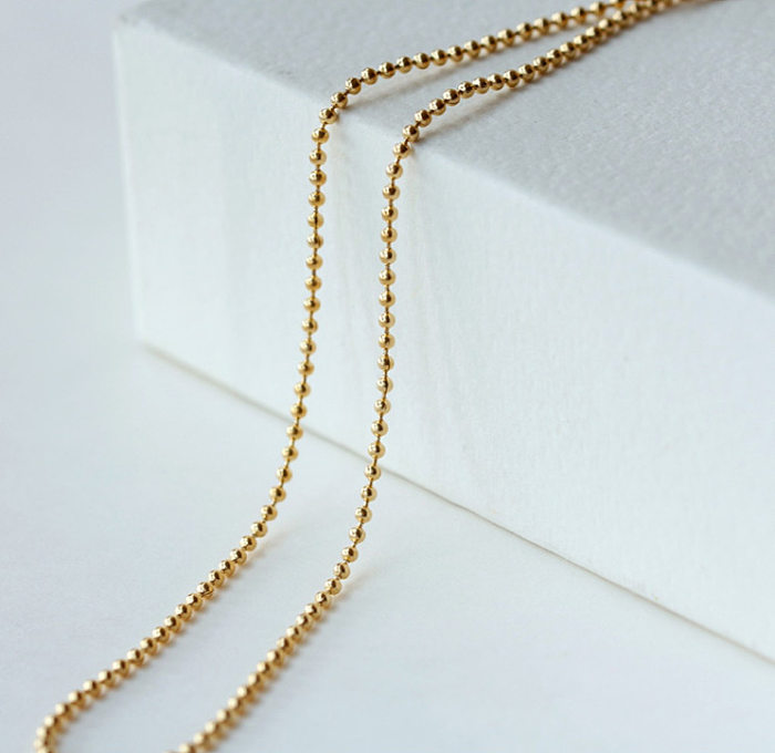 Einfache geometrische Halskette aus Edelstahl mit Perlen und Perlen aus Edelstahl