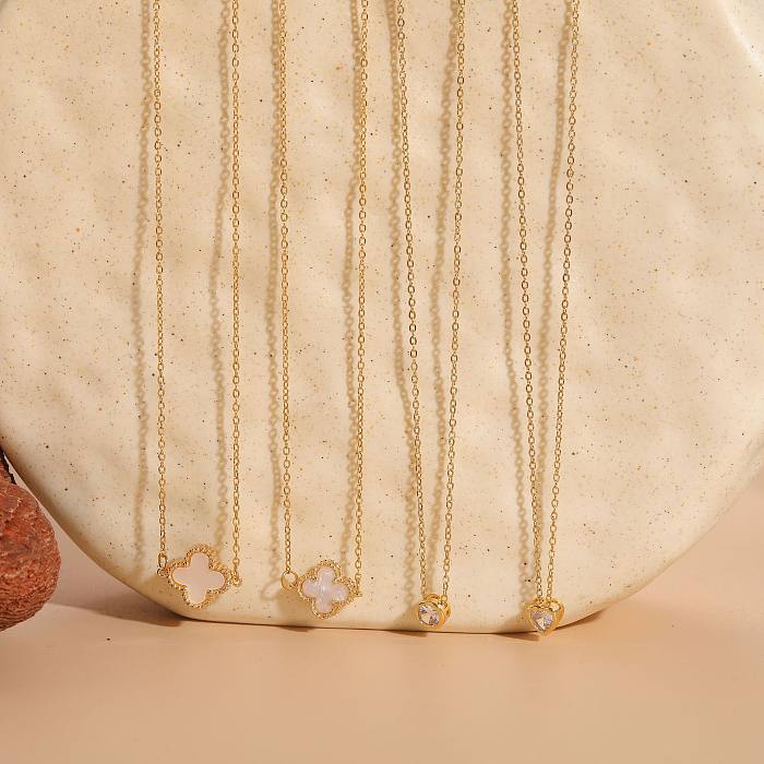 Collier pendentif en plaqué or 14 carats avec trèfle à quatre feuilles de style classique de vacances en forme de cœur rond en acier inoxydable avec incrustation de résine et zircone