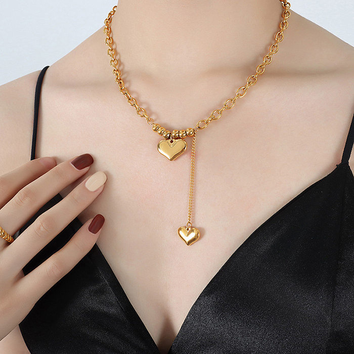 Collier long avec pendentif plaqué or 18 carats, style simple, en forme de cœur, plaqué en acier inoxydable
