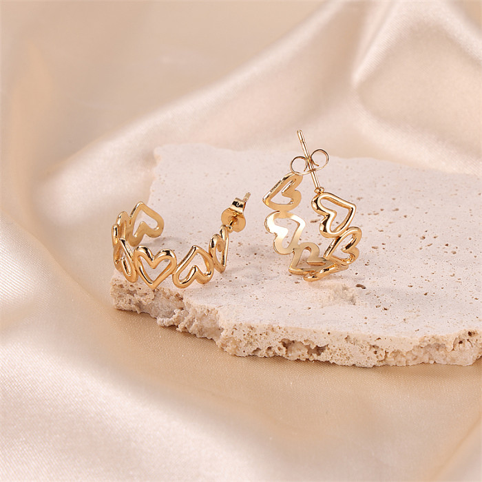 1 par de pendientes básicos chapados en oro de acero inoxidable con forma de corazón de estilo coreano para mujer