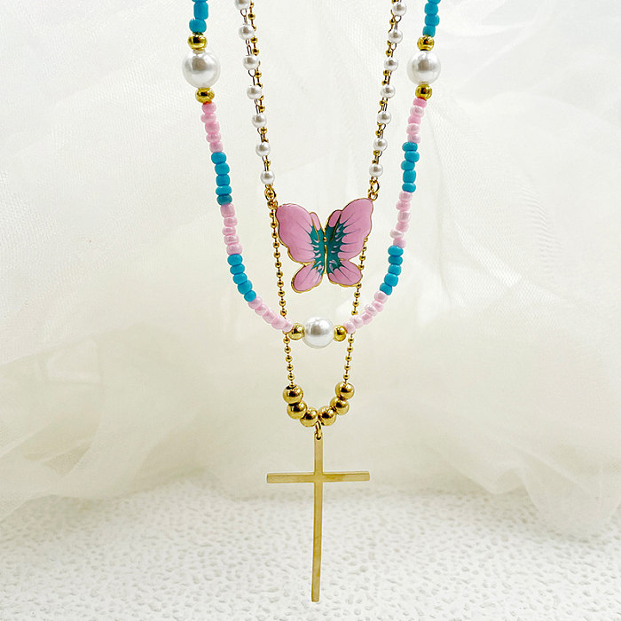 Elegante Halskette mit künstlerischem Kreuz und Schmetterling im Vintage-Stil, Edelstahl, Perlen, Emaille-Beschichtung, vergoldet, dreilagige Halskette