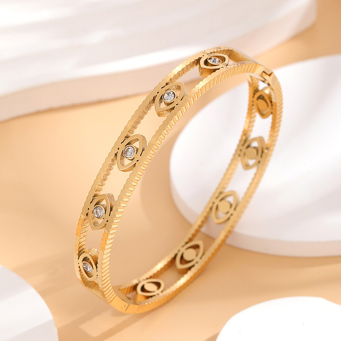 Brazalete chapado en oro de diamantes de imitación con incrustaciones de epoxi de acero de titanio con ojo artístico de estilo francés