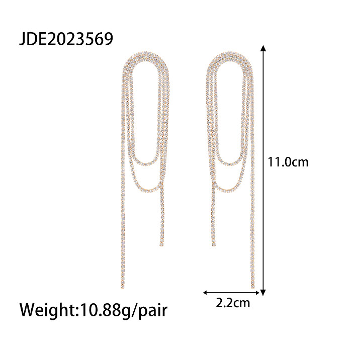1 paire de boucles d'oreilles pendantes avec incrustation de pampilles en cuivre et strass