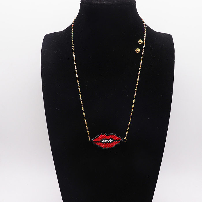 Collier avec pendentif en acier inoxydable en forme de cœur avec lèvres artistiques