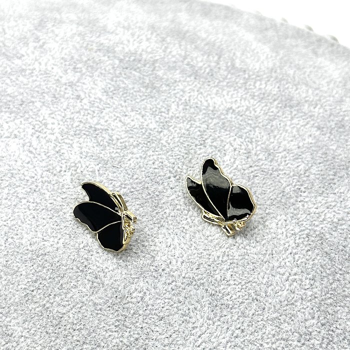 1 paire de clous d'oreilles papillon en acier inoxydable, style simple