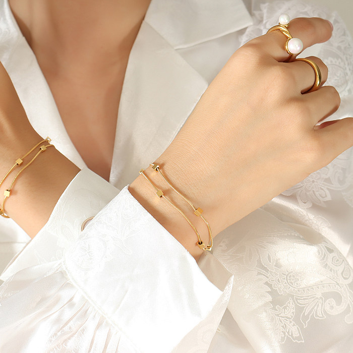 Bracelets plaqués or 18 carats en acier titane carré élégant de style féerique
