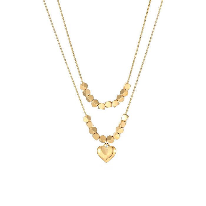 Collar colgante chapado en oro de acero inoxidable con forma de corazón de estilo simple a granel