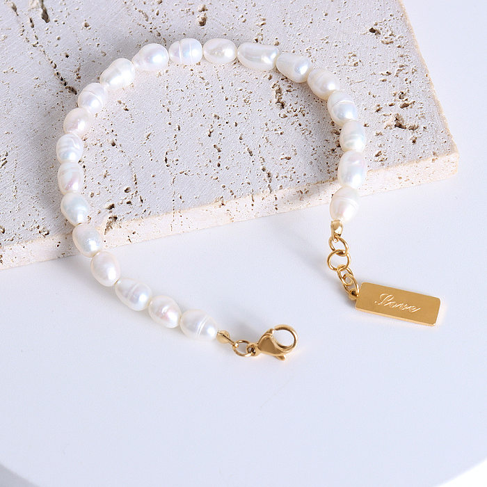 Bracelet de perles d'eau douce plaqué or 18 carats, titane et acier, tempérament à la mode, vente en gros