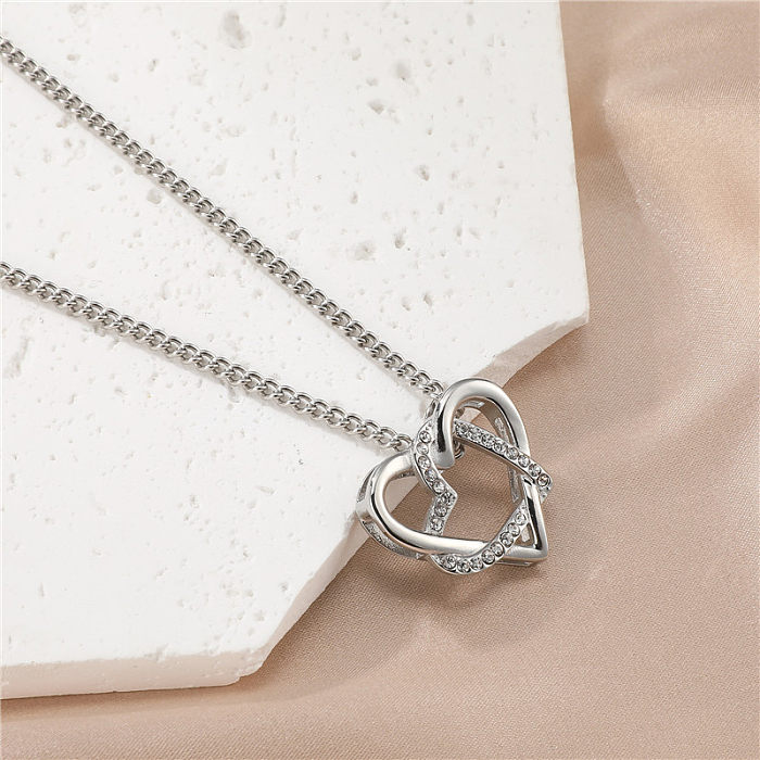 Süße schlichte Herzform-Edelstahl-Halskette mit ausgehöhltem Inlay-Zirkon-Anhänger