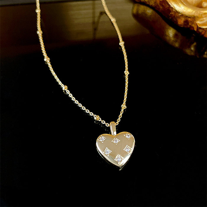 Elegante coração forma arco nó liga de aço inoxidável chapeamento inlay zircão pingente colar