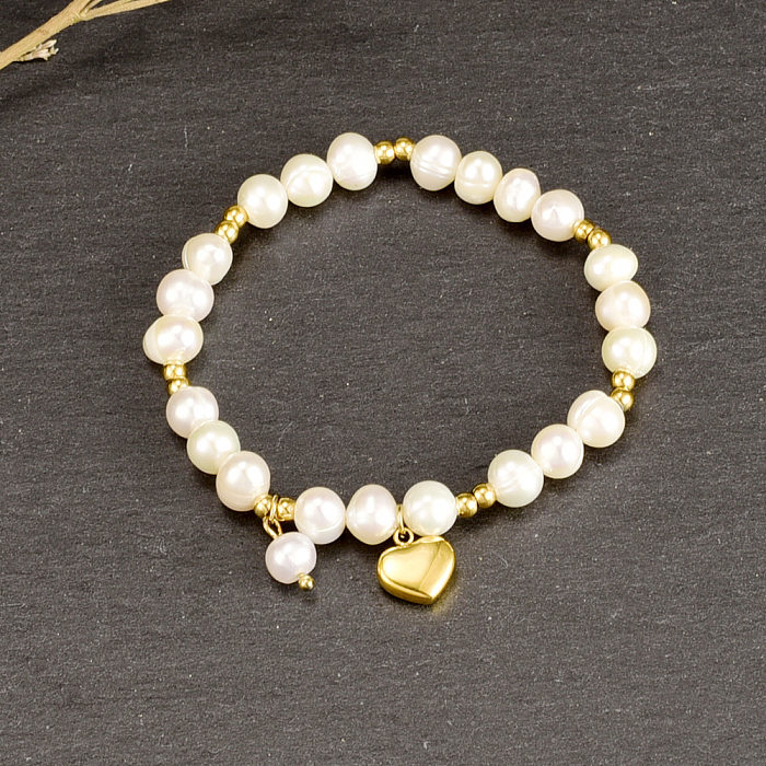 Pulsera con colgante de corazón de perla redonda de acero titanio chapado en oro de 18 quilates estilo vintage