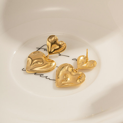 زوج واحد من الأقراط المتدلية المطلية بالذهب عيار 1 قيراط المصنوعة من الفولاذ المقاوم للصدأ على شكل قلب على شكل IG