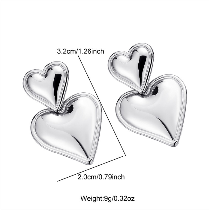 1 paire de boucles d'oreilles mignonnes en forme de cœur en acier inoxydable
