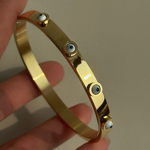 Bracelet en zircon plaqué or 18 carats en acier titane pour les yeux de style simple en gros