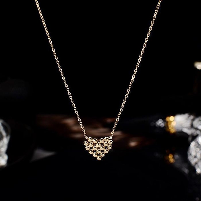 Collier pendentif en acier inoxydable plaqué en forme de coeur géométrique de style simple à la mode