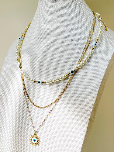 Collier avec pendentif en forme d'oeil de soleil de style baroque, en acier inoxydable, plaqué de perles d'eau douce, plaqué or 14 carats