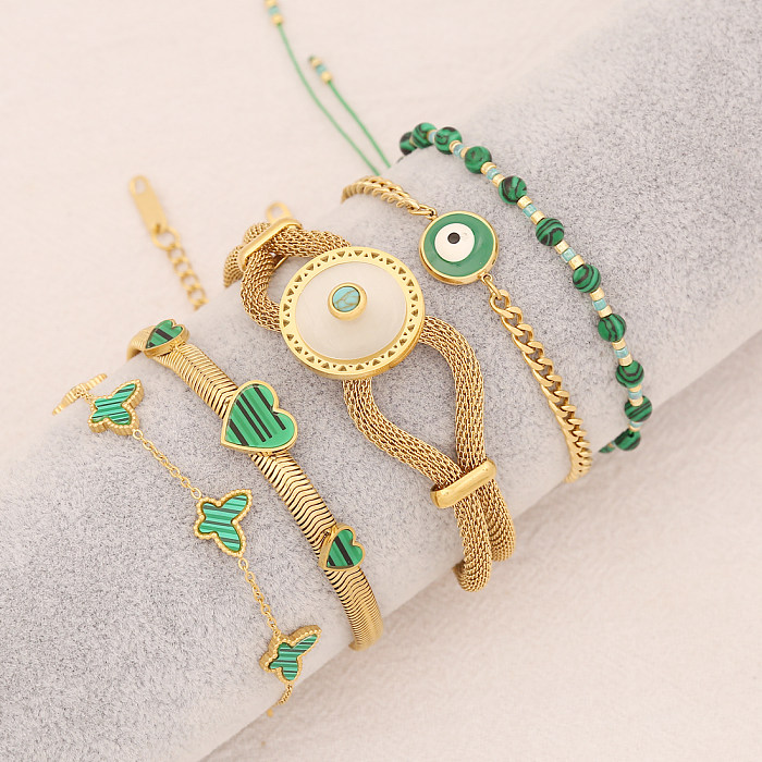 Bracelets de placage en acier inoxydable de papillon d'oeil de forme de coeur de style simple romantique