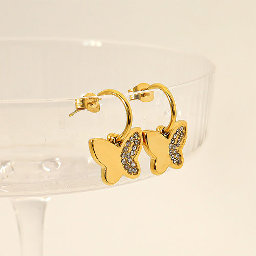 1 paire de boucles d'oreilles pendantes plaquées or 18 carats avec incrustation de papillon de style français de style IG en acier inoxydable et zircon