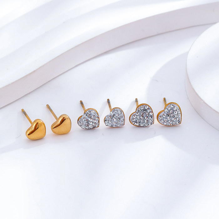3 pares de aretes chapados en oro de 24 quilates con incrustaciones de acero inoxidable en forma de corazón redondo de estilo simple